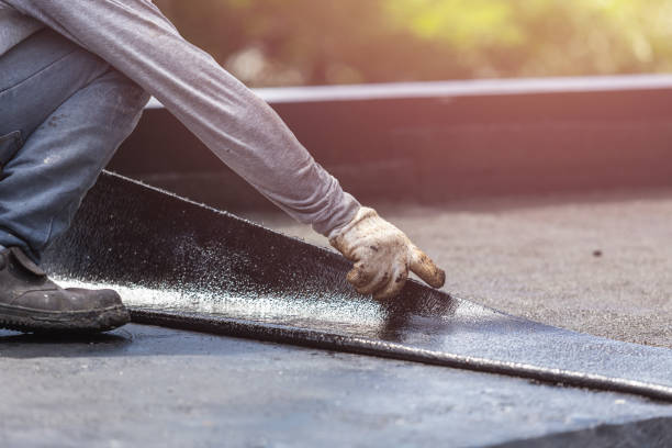 Professional Basement Waterproofing technician working in Wales Center, NY